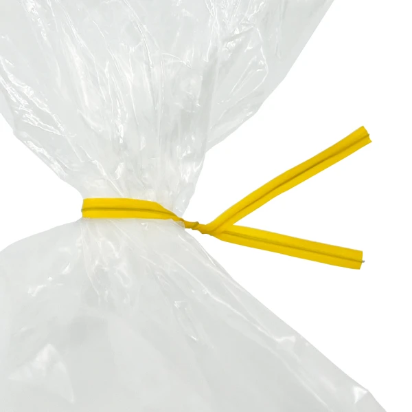 6 Inch Yellow Plastic Twist Ties Tied on Bag Close up of 6 Inch Yellow Plastic Twist Ties Tied on Bag