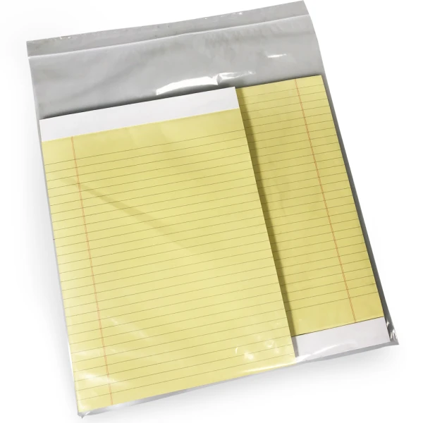 13 x 15 2 Mil Clearzip Lock Top Bags Protecting Product Two Yellow Notepads in 13 x 15 Clearzip Lock Top 2 Mil Bags