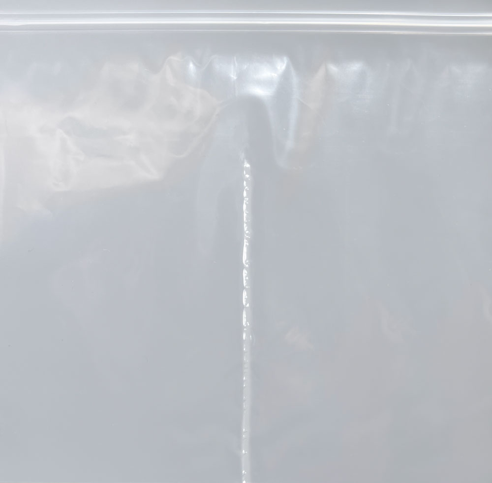 Close up of 3 Inch of Divider Seal of 7x4 2 Mil Reclosable Compartment Bag with 3 Inch Vertical Middle Seal